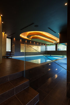 Modern swimming pool with water in a luxury villa
