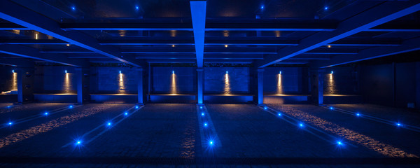 Modern private car park with illuminated roof, empty