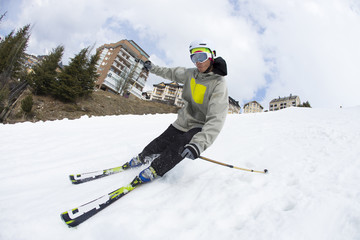 Skier in mountains, prepared piste and sunny day