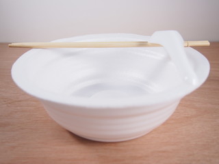 Fototapeta na wymiar Empty disposable foam bowl with kitchen ware equipment