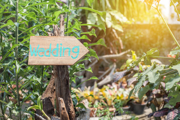 Wooden signboard with the inscription in  paint wedding. Wood hand made wedding decoration table.