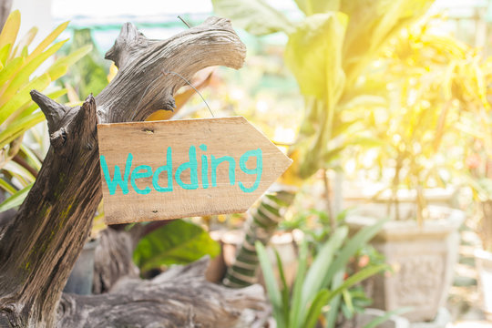 Wooden signboard with the inscription in  paint wedding. Wood hand made wedding decoration table.