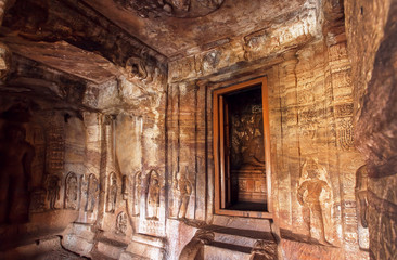 Interior of the 7th century cave temple in Badami complex of Karnataka, India. Inside are four Hindu, Jain and Buddhist cave temples