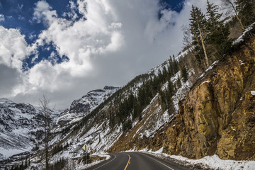 Windy mountain road with a little snow