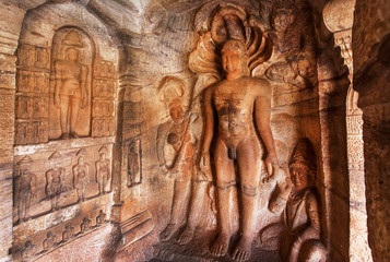 Interior of the 7th century cave temple with hero sculpture Parshvanatha in Badami complex of Karnataka, India