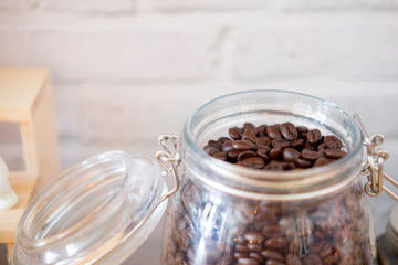 Fresh coffee beans In glass jar.