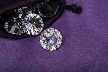 Diamond / View of diamond in bag on fabric.