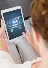 Woman using Tablet with Shopping trolley icon