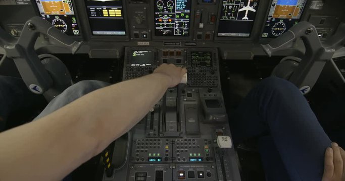 Airplane pilot's hand pushing thrust during take off. 4K