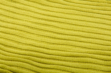 Background made by piece of green knitwear