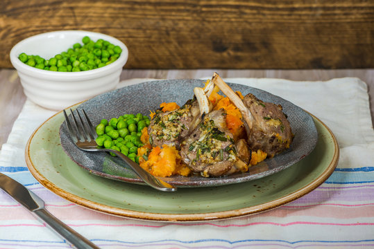 Rosemary lamb chops with carrot and parsnip mash and green peas