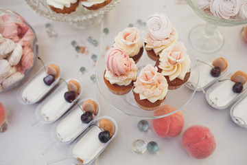 Look from above at glasses with berries and other sweets