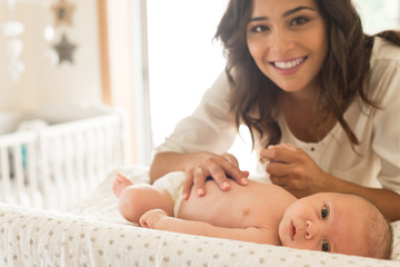Mother moisturizing baby