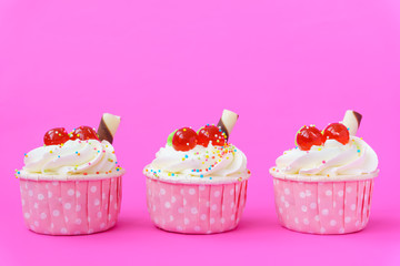 Cupcake on pink background.