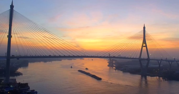 aerial view of bhumiphol bridge and container ship in chaopraya river at morning