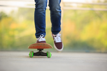 skateboarder legs skateboarding at skatepark