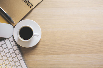 Keyboard, coffee and cobybook