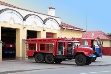 old fire engine near fire station