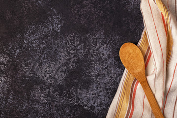 Kitchen background with towel and cooking tools.