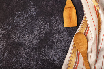 Kitchen background with towel and cooking tools.