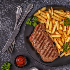 Beef barbecue steak with french fries.