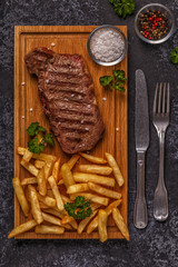 Beef barbecue steak with french fries.