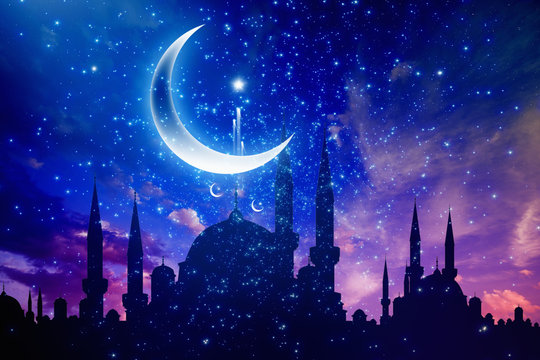 Ramadan Kareem background with mosque silhouettes, crescent and stars
