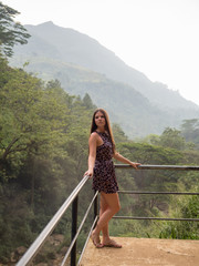 girl on terrace with mountains on background