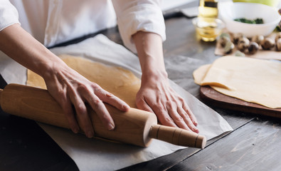 Step by step the chef prepares ravioli with ricotta cheese, yolks quail eggs and spinach with spices. The chef works with the dough