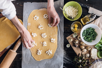 Step by step the chef prepares ravioli with ricotta cheese, yolks quail eggs and spinach with...