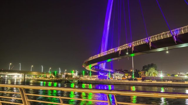 night illumination dubai famous new water canal crossing bridge panorama 4k time lapse uae

