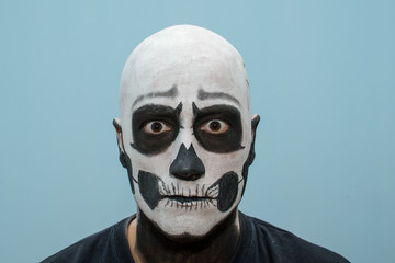 Naklejka premium Beautiful man with creative make-up for the Halloween party
