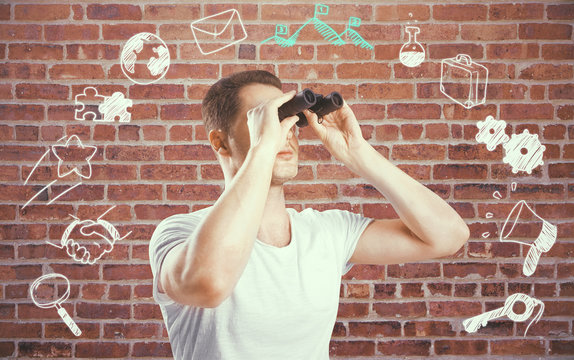 Man with binoculars and business icons