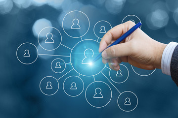 Businessman draws a network of clients.