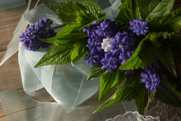 Bouquet of flowers on a wooden background 2