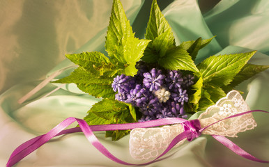 Bouquet of lilac flowers and lace bow 2