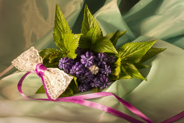 Bouquet of lilac flowers and lace bow 4