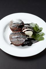 Chocolate fondant with ice cream. Dessert.