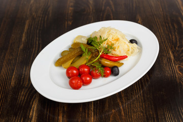 Appetizer of tomatoes, cucumbers, cabbage and pepper