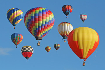 Collection of hot air balloons against a blue sky