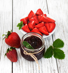 Strawberry jam and fresh strawberries
