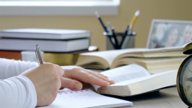 Young woman studying the Bible closeup.  Dolly shot closeup.