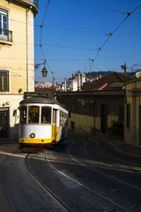 Naklejka na ściany i meble The traditional 28 Tram in the historic neighborhood of Chiado in Lisbon, Portugal; Concept for travel in Lisbon