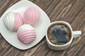 Sweet pink marshmallow - zephyr and cup of coffee
