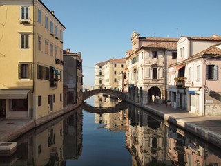 Fototapeta na wymiar Chioggia, Italy. Ancient palaces sprawl in the water.