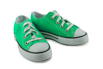 Green children's sneakers isolated on a white background