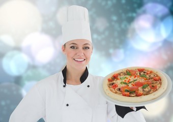 Chef with pizza. Lights background
