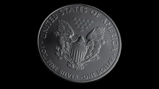 close-up shot one dollar silver eagle coin flying
