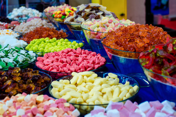 many varieties of jelly candies on a market stall