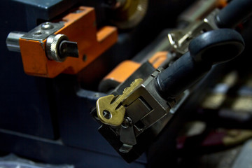 Machine production of duplicate metal key.